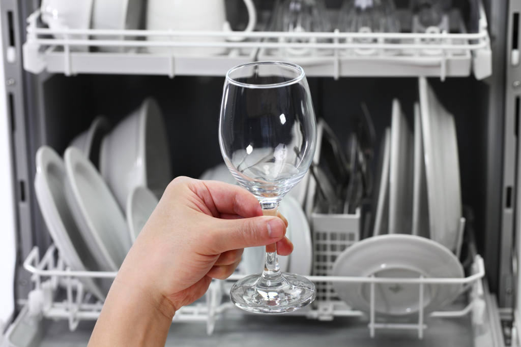 holding spotless glass from dishwasher using water softener